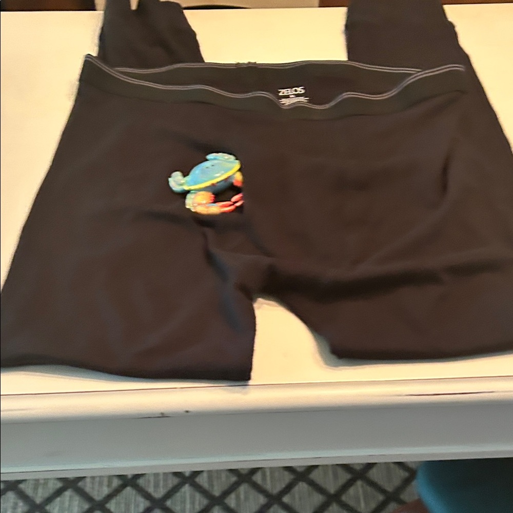 Black XL Zeros lounging pants and crap is in the fly opening. Cotton material.